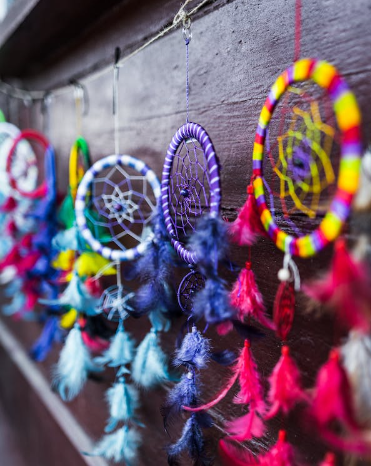  Colorful dream catchers hanging against the wall. 